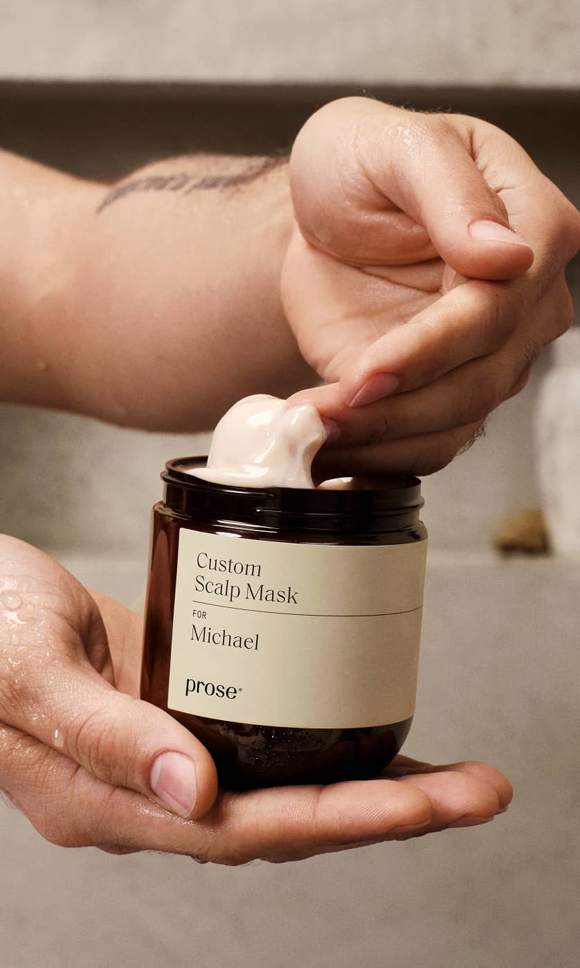A-hand-scooping-the-Prose-personalized-scalp-mask._.jpg
