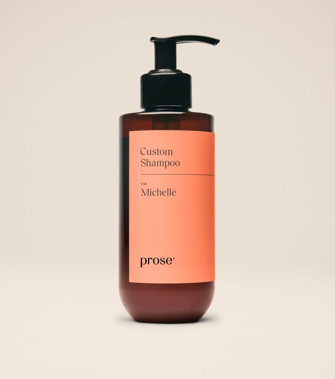 Prose-Custom-Shampoo-bottle-labeled-for-Michelle-standing-upright-against-a-beige-background.jpg