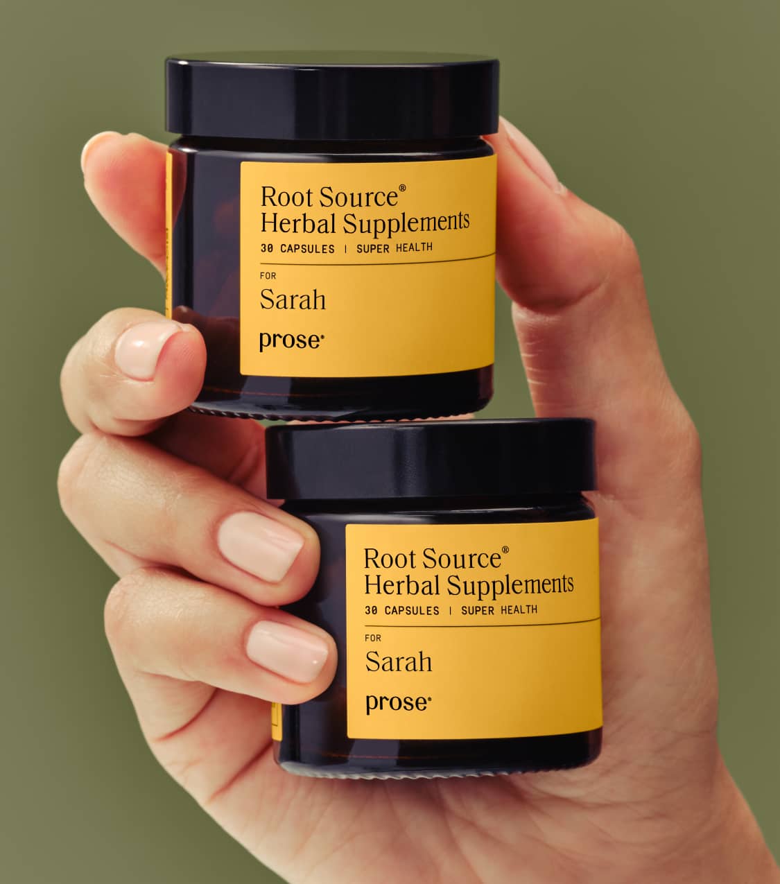 Prose-model-holding-custom-root-source-hair-supplements-in-packaging.jpg